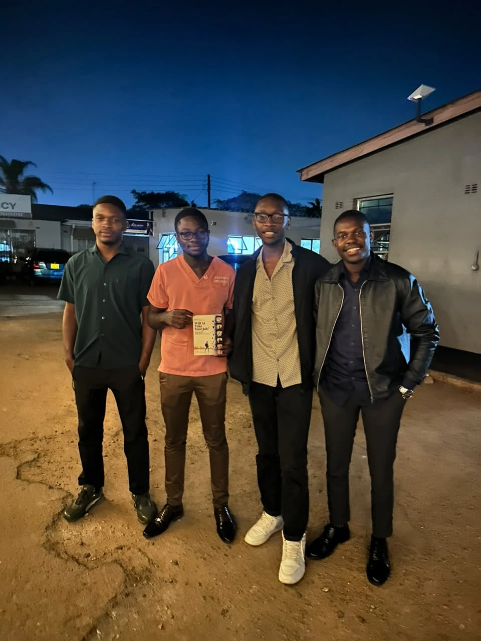 A group of readers with the book